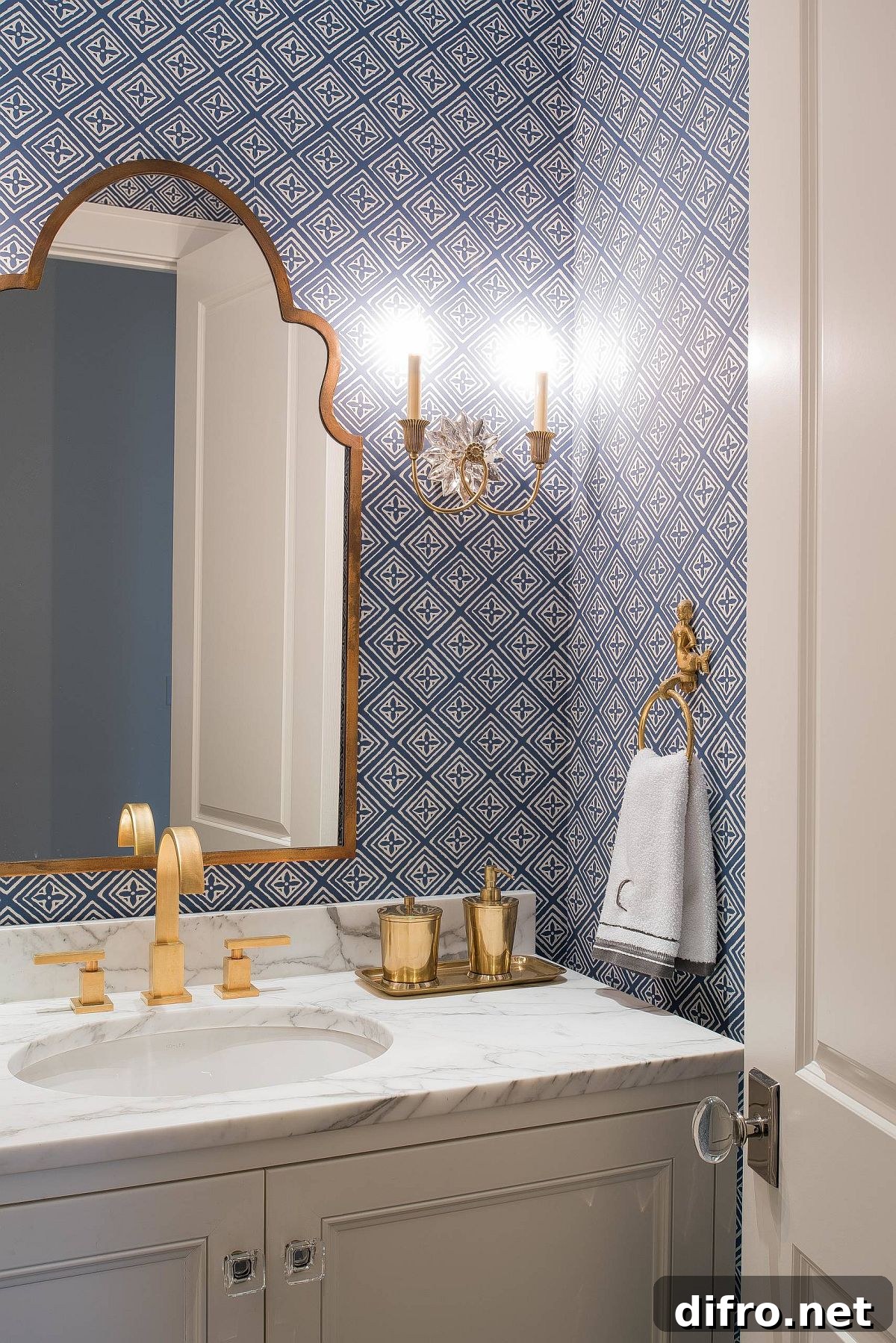 Sconce light beside a bathroom mirror