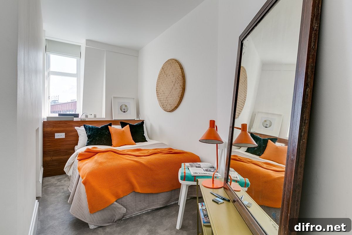 Small modern London bedroom in white with mirror and yellow accents