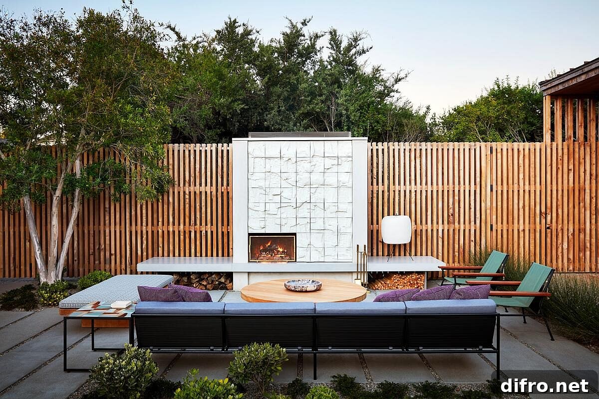 Relaxing rear yard hangout next to the fireplace is surrounded by wooden fence