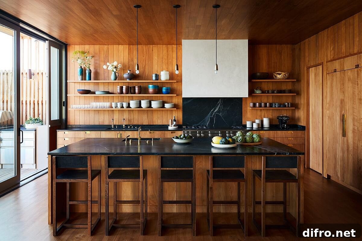 Break the monotony in the kitchen with a tone countertop and backsplash in dark stone