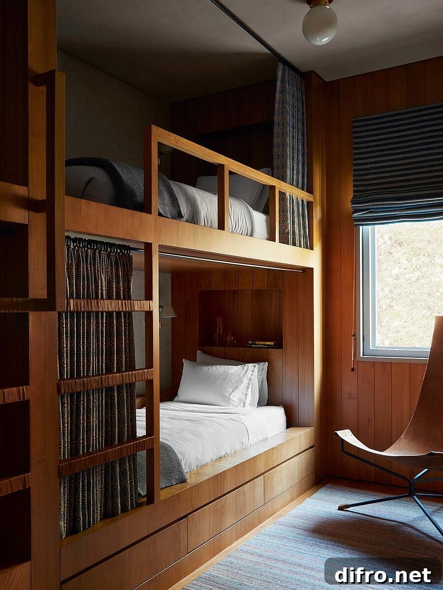 Lovely custom bunk beds draped in wood save space in the small modern bedroom