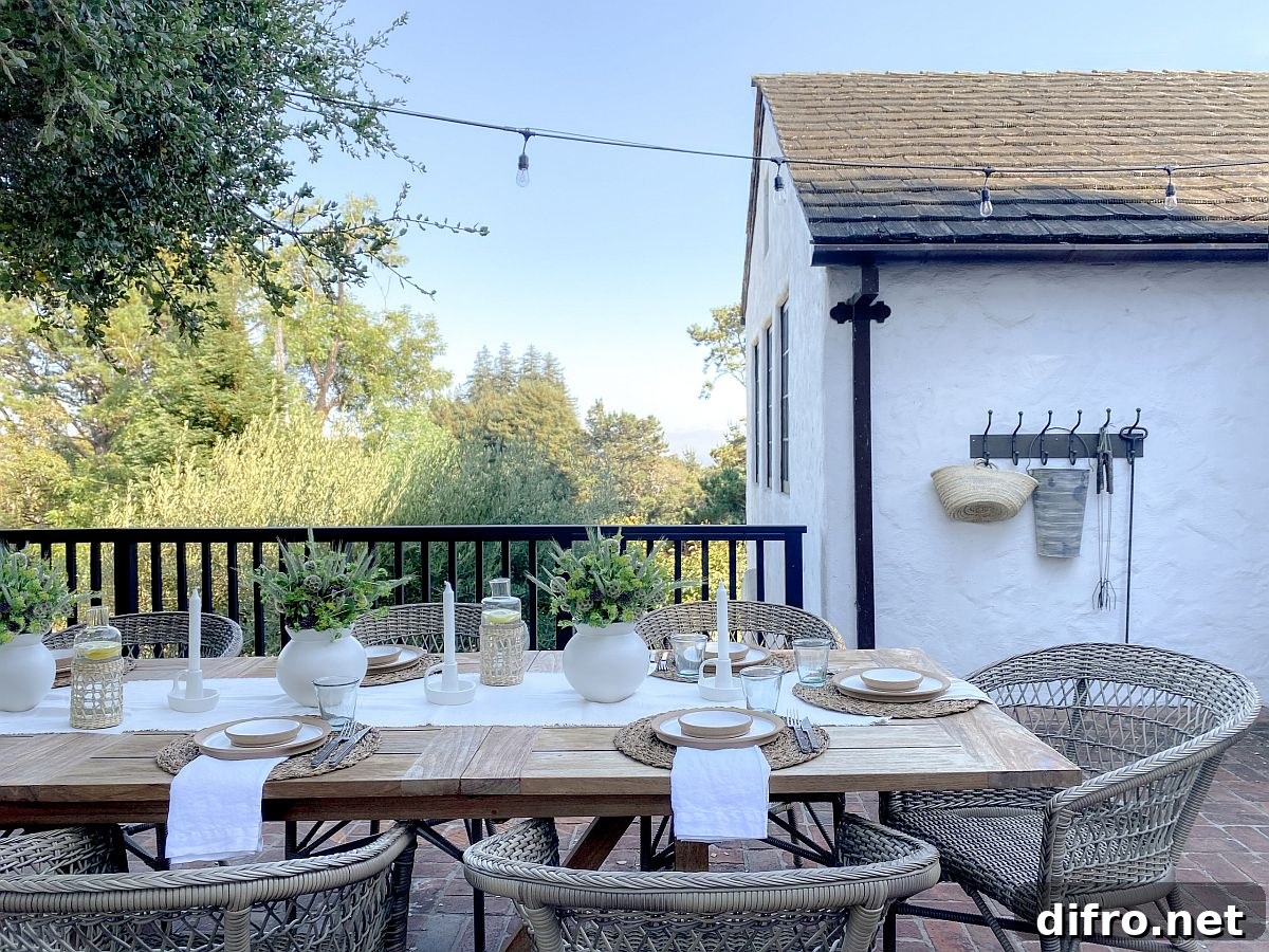 Outdoor dining lit by string lights