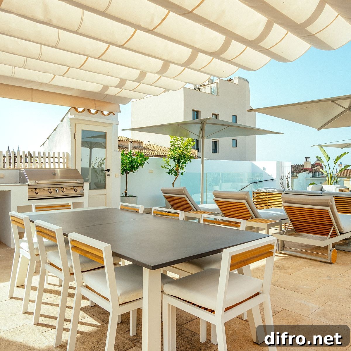 Minimal contemporary deck with white chairs and table