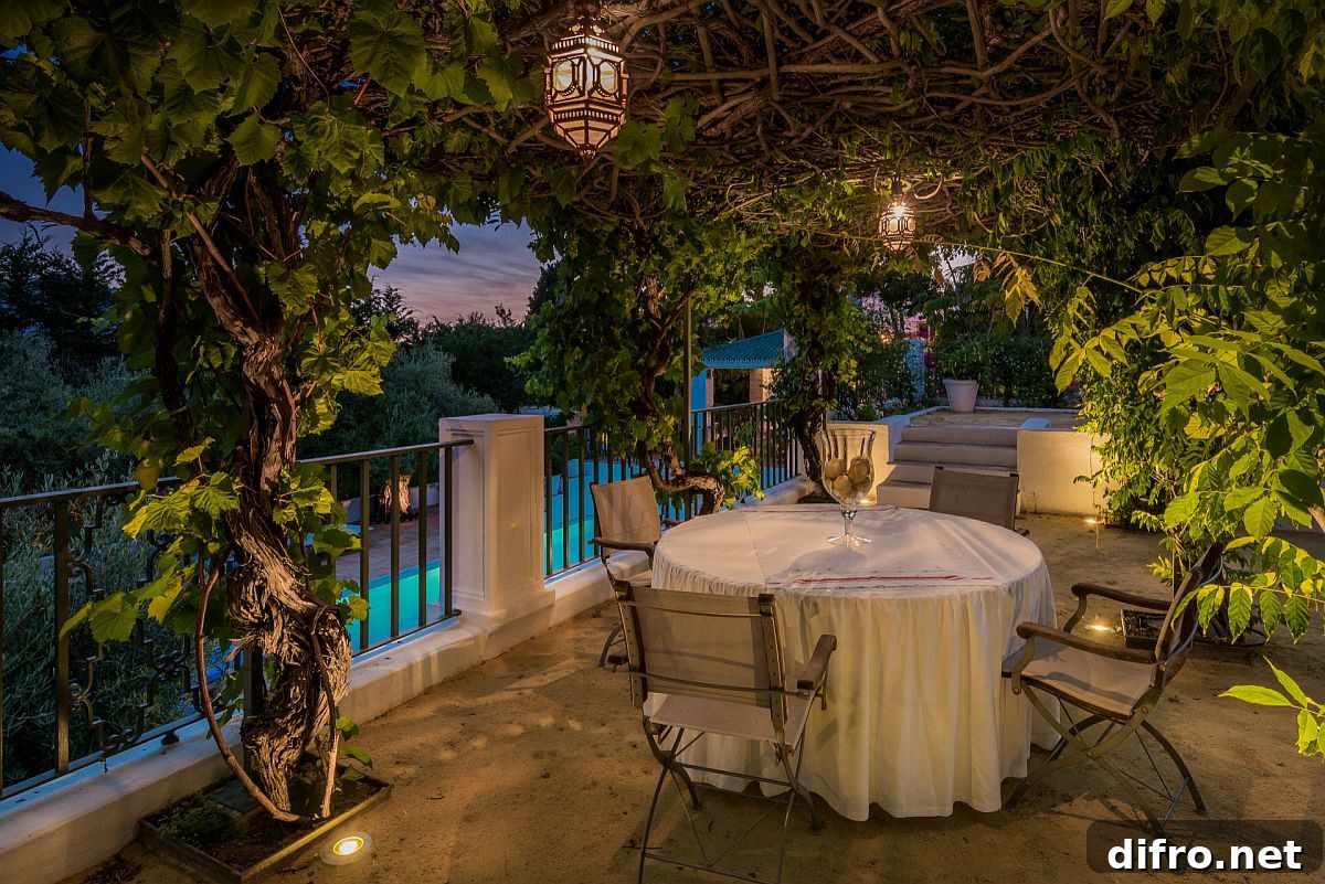 Mediterranean style deck with greenery and in-ground lighting