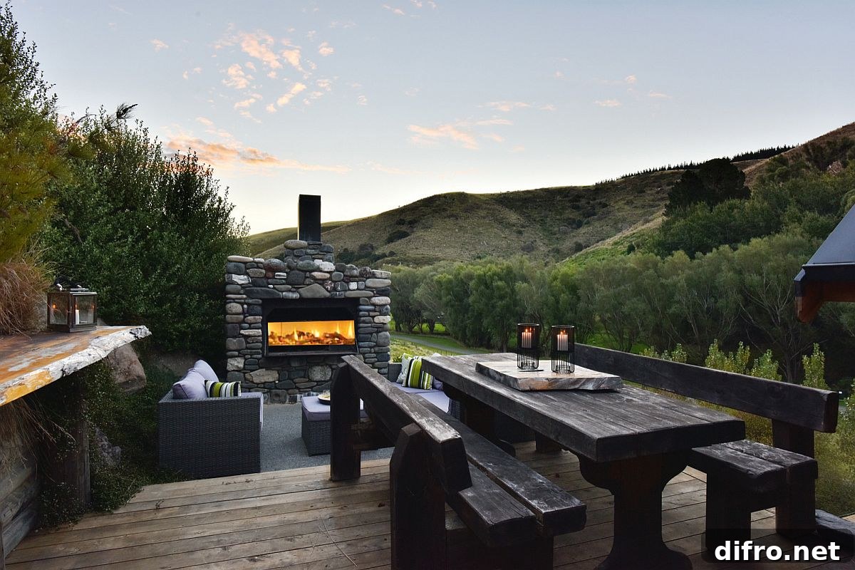 Outdoor stone fireplace and dining area
