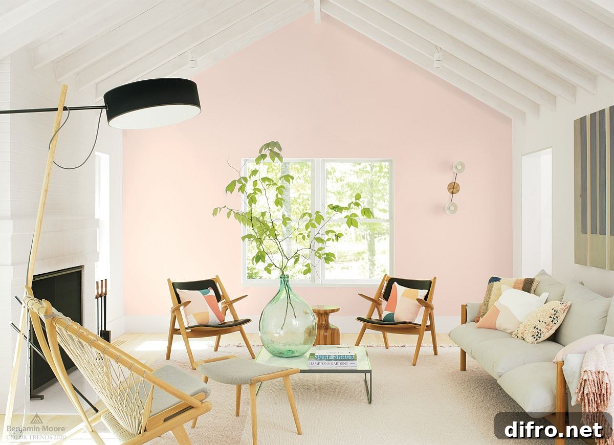 Brilliant blend of Japanese and Scandinavian styles in the small living room with pink accent wall