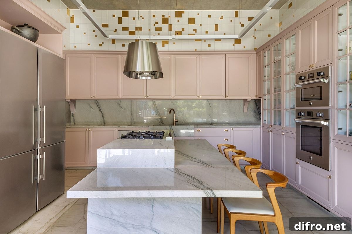 Pastel pink cabinets and light green add color to the modern kitchen