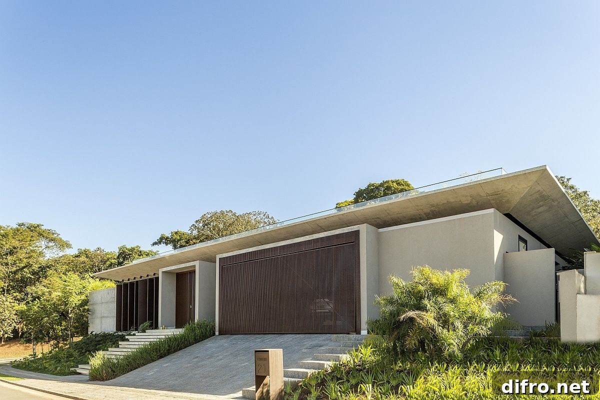 Stylish street facade of the home offers complete privacy while separating it from the crowd