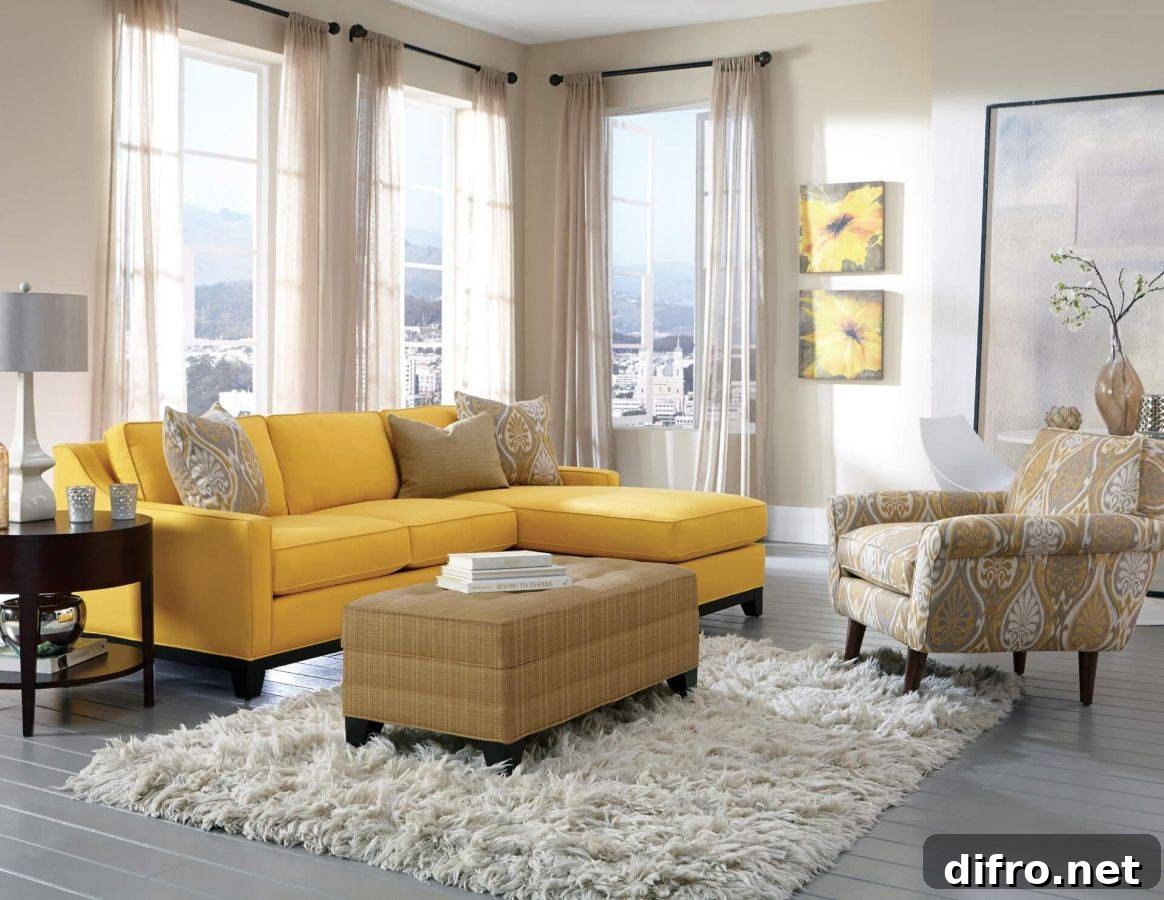yellow couch with brown chair and footstool in living room