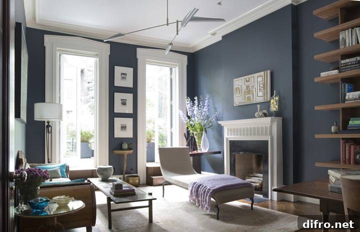 blue living room walls with high ceiling and brown furniture