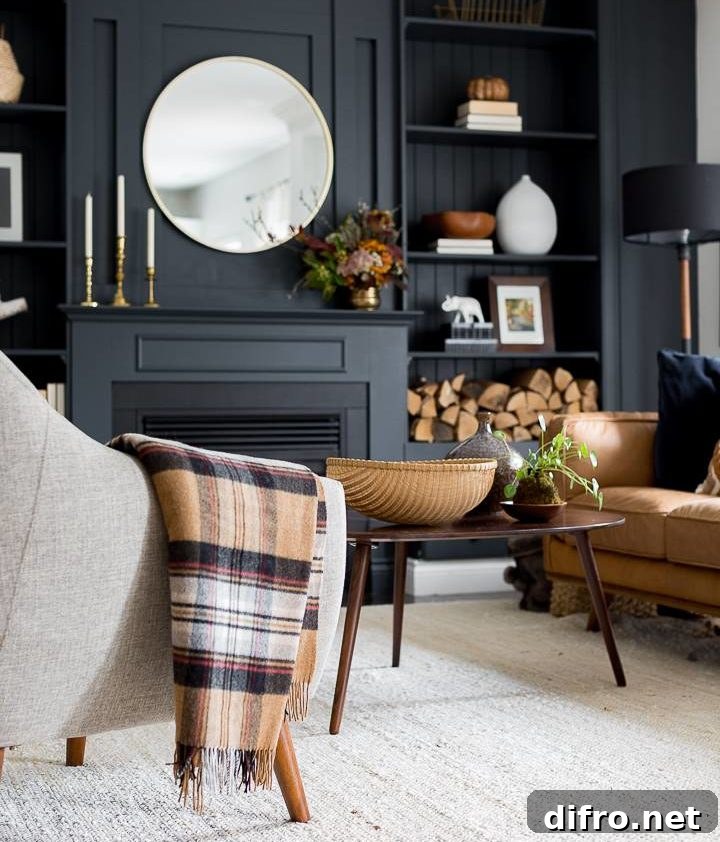 black fireplace surrounding with brown furniture and decor accents