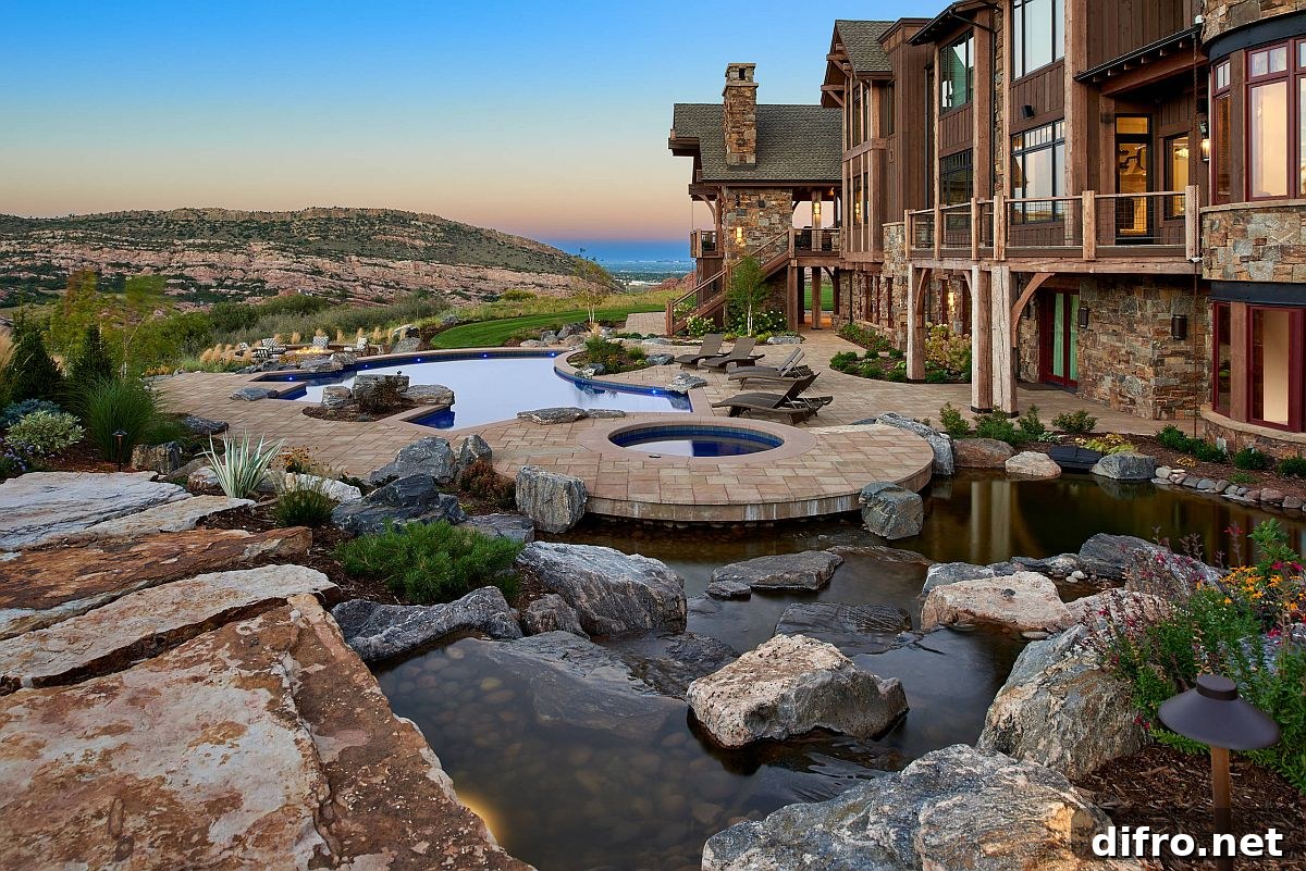 Pond and pools in a rustic backyard with a view