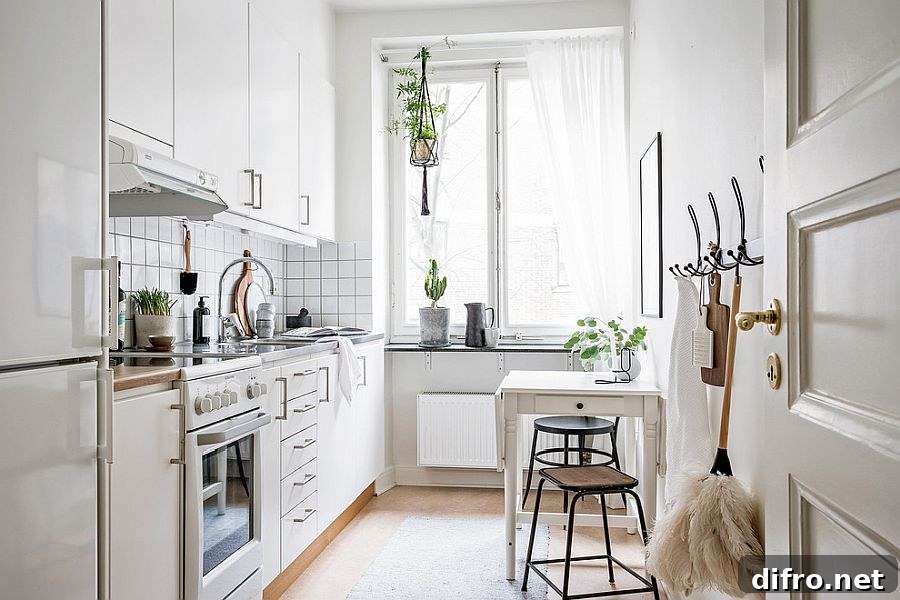 Compact white breakfast nook in a small apartment