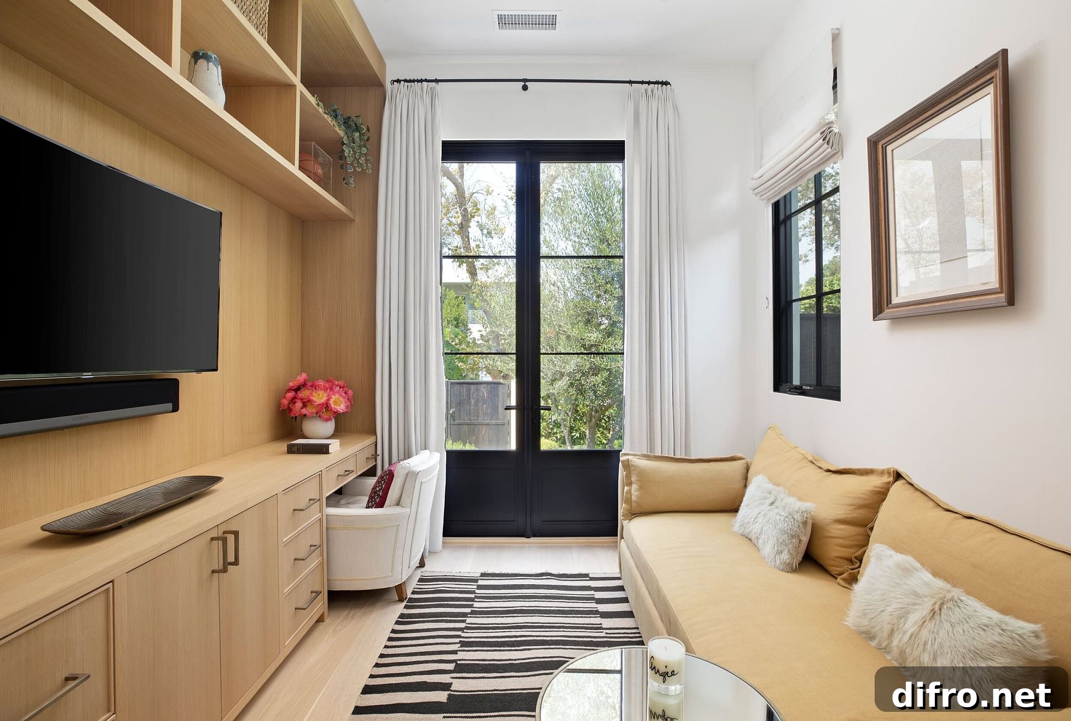 Small TV room and home office with custom wooden shelves and a comfy couch