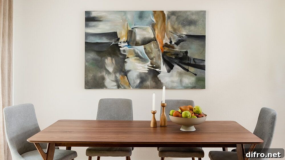 Dining room with wall art as the focal point against a neutral backdrop