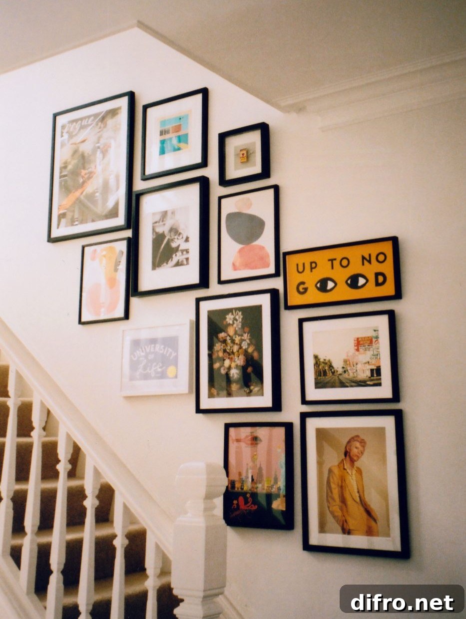 colorful gallery wall display ascending up staircase