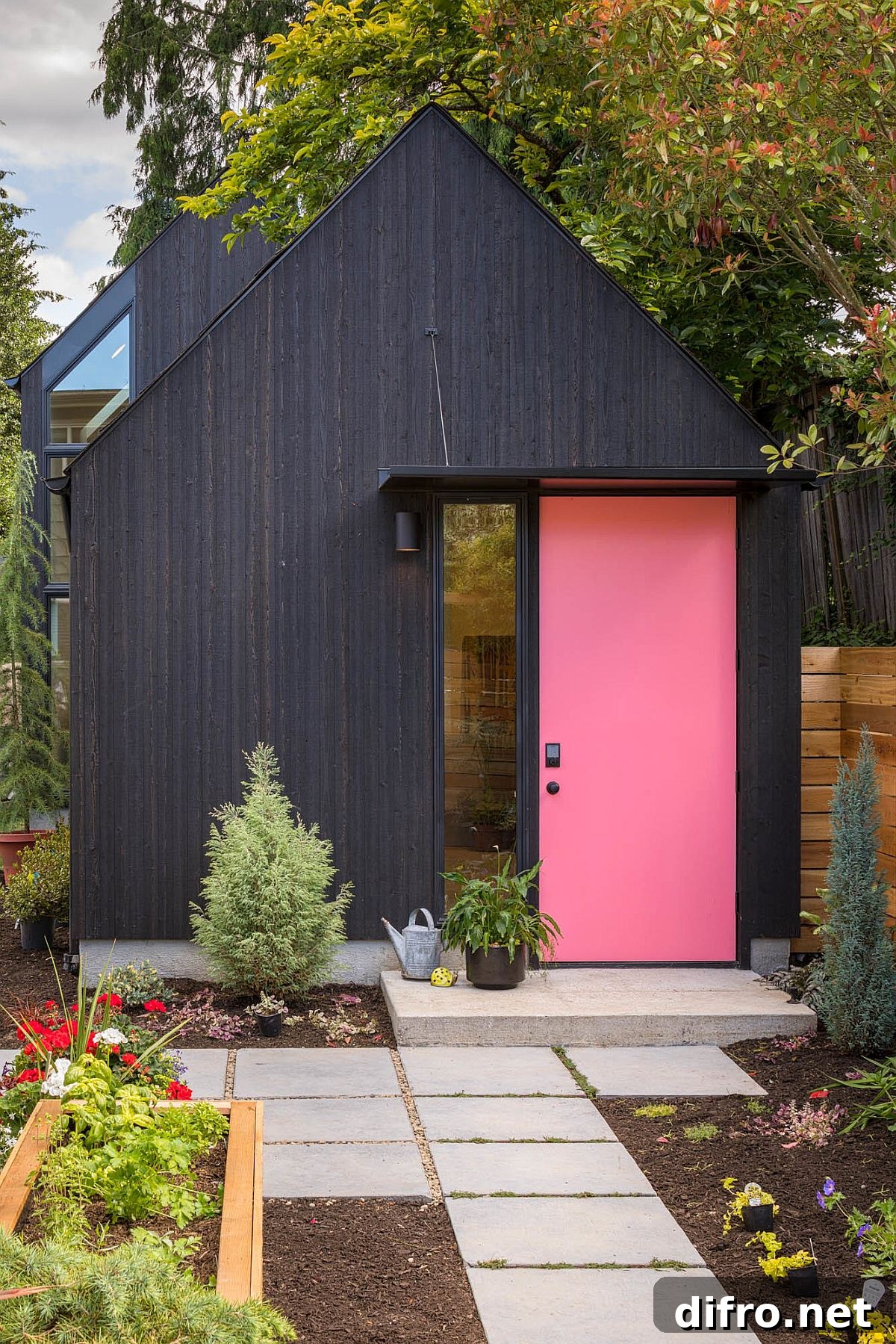 Dark exterior with pink door