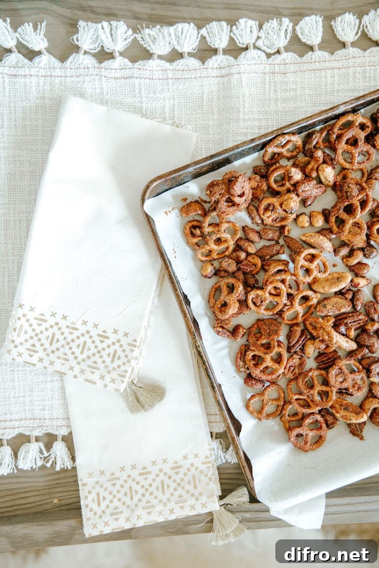 Maple roasted snack mix styled on a baking sheet
