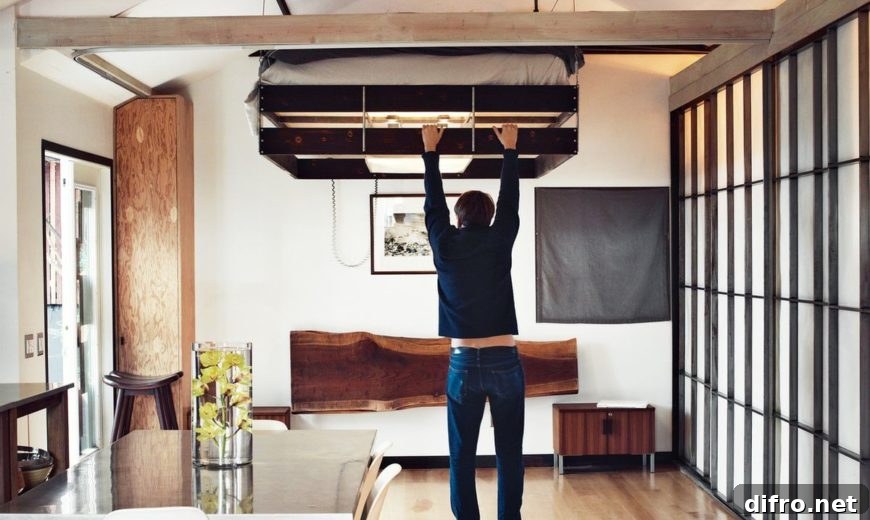 Pull-down loft bed in a small apartment