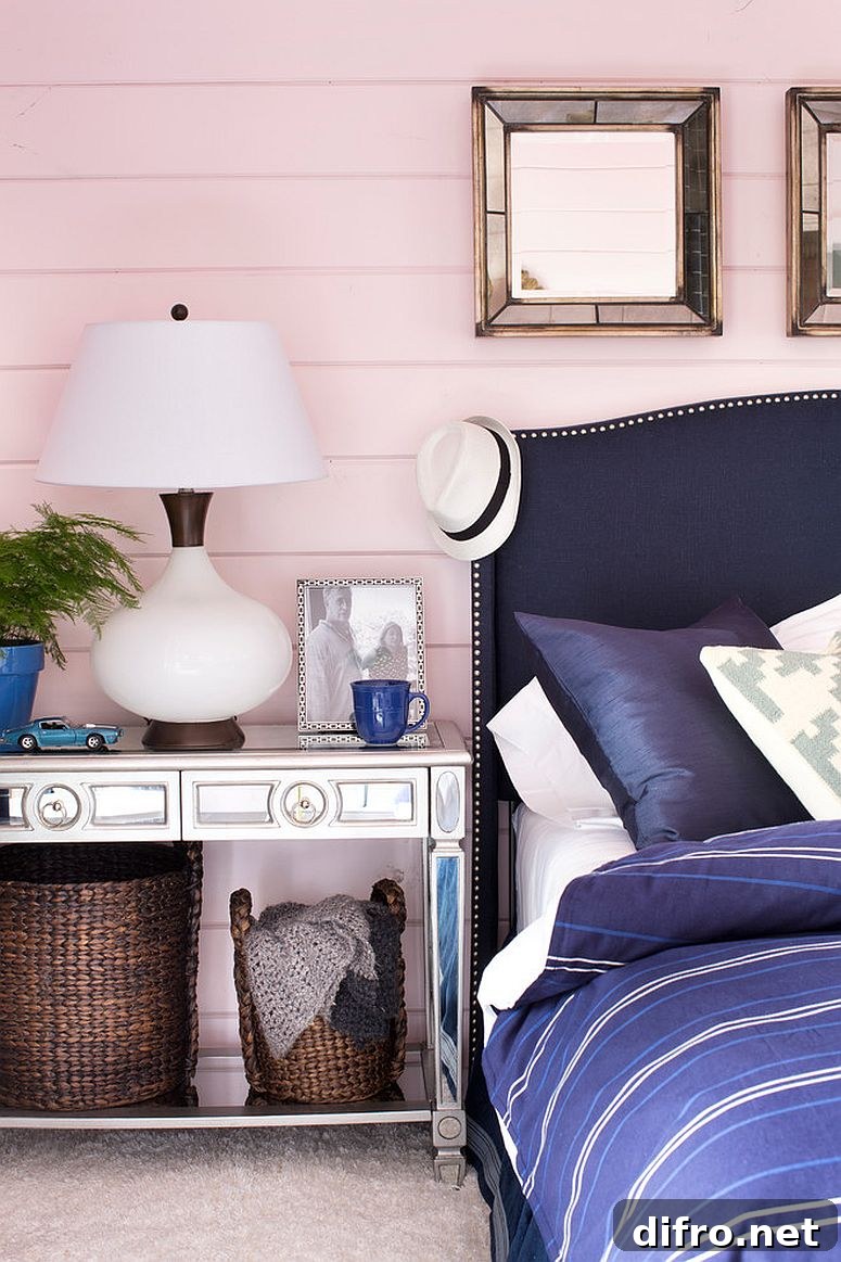 Pastel pink and bright blue blend in a bedroom design