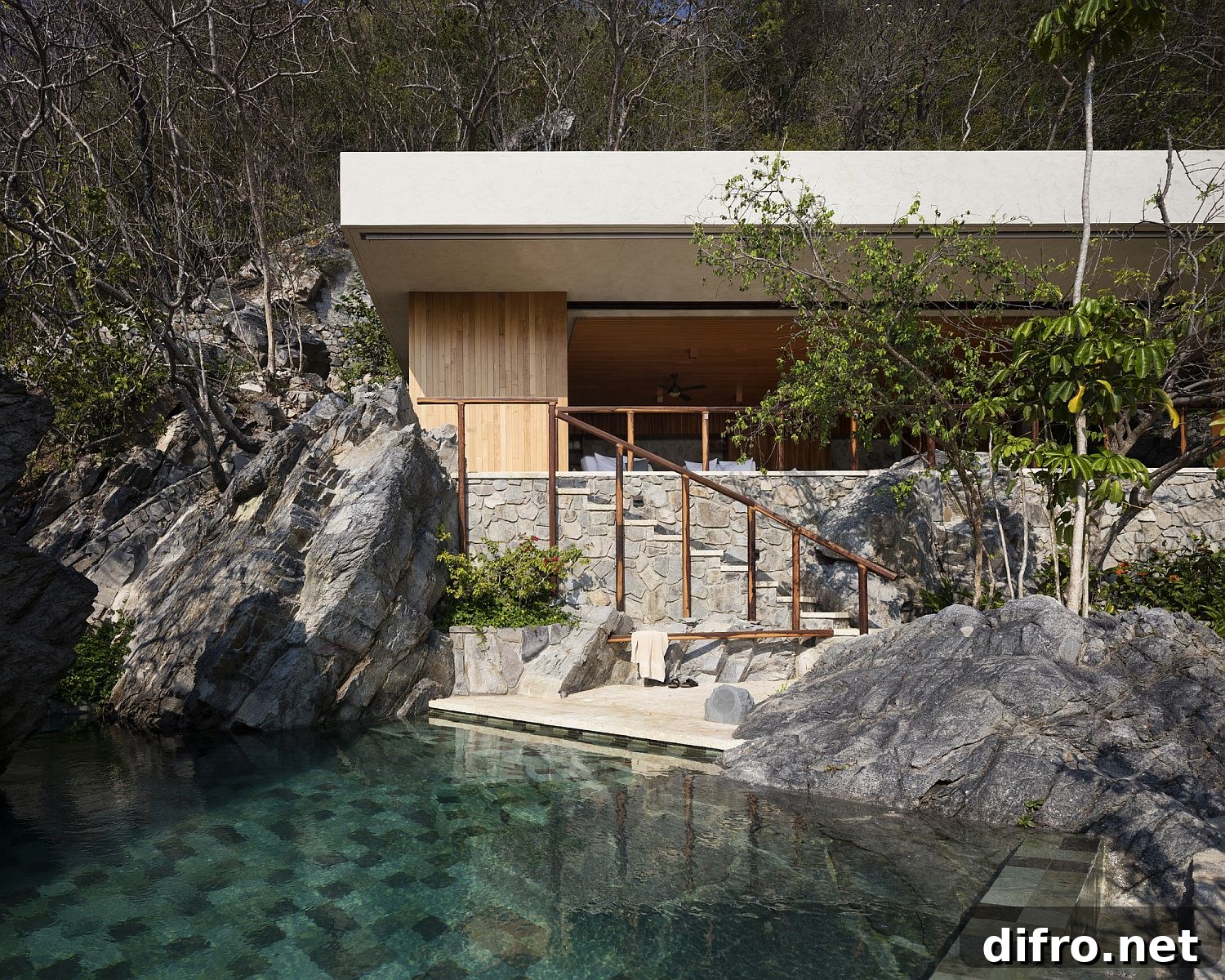 Relaxing pool styled to imitate a natural tide pool beside the ocean