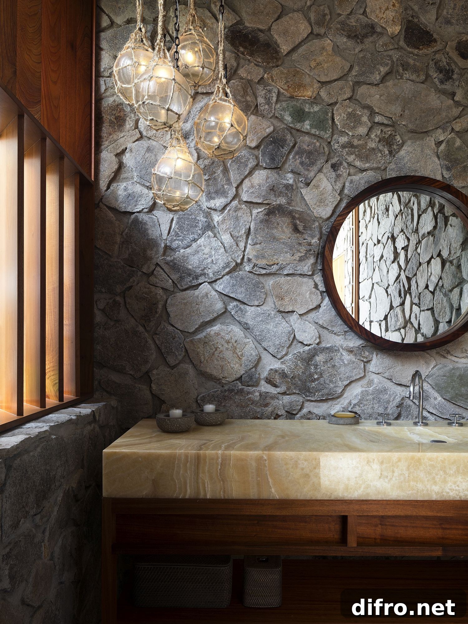 Bathroom finished in stone with a wooden vanity