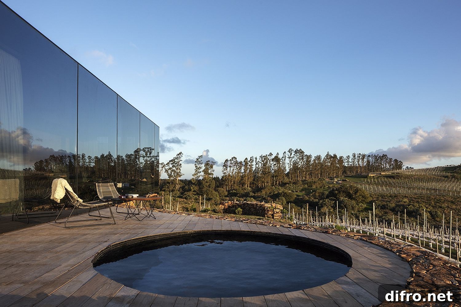 Circular pool and wooden deck outside the cabin