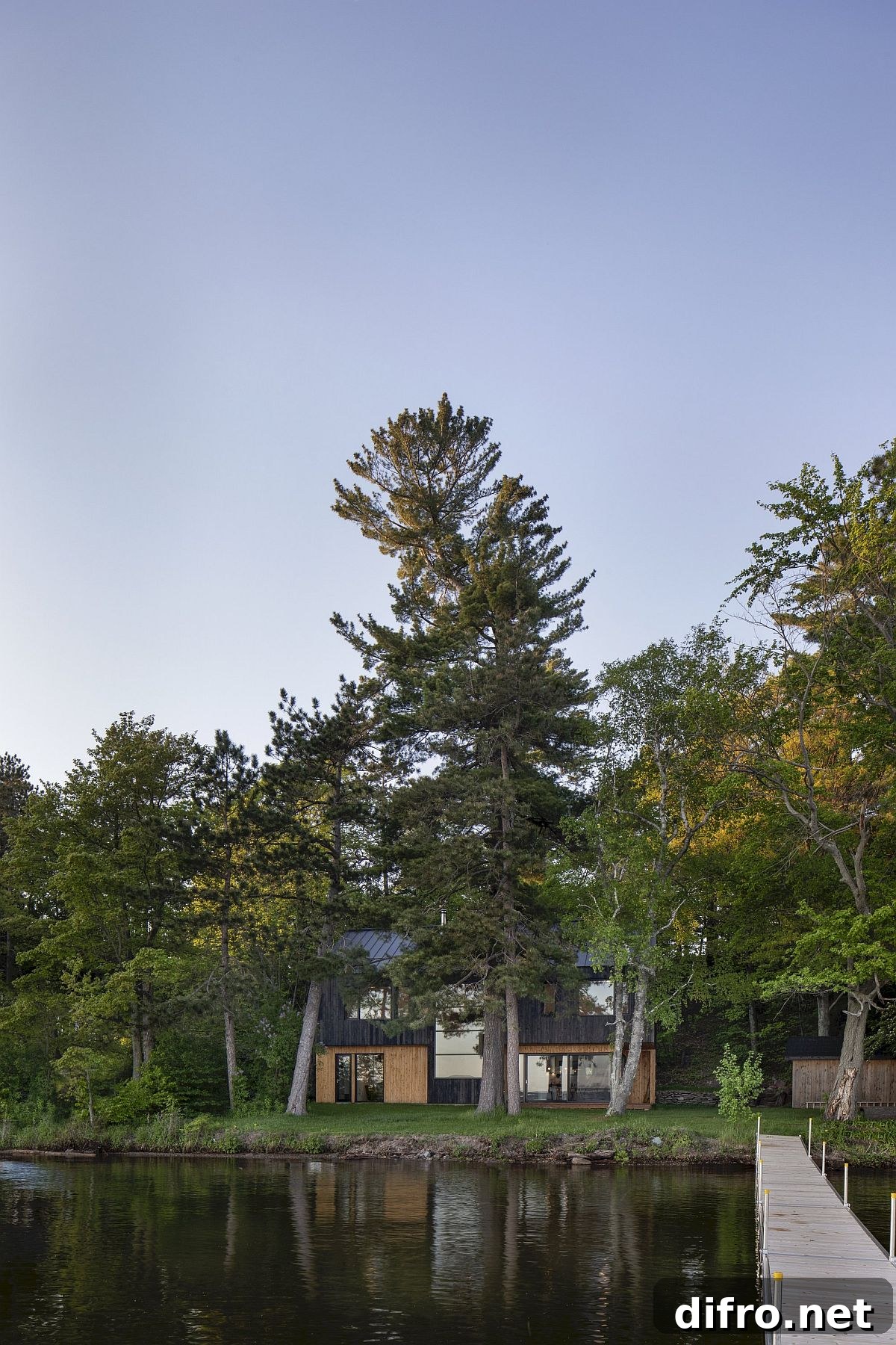 Natural greenery and a view of the lake steal the spotlight at this Lakeside Cabin in Canada