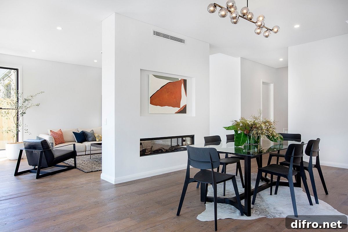 Fireplace wall delineates living and dining spaces