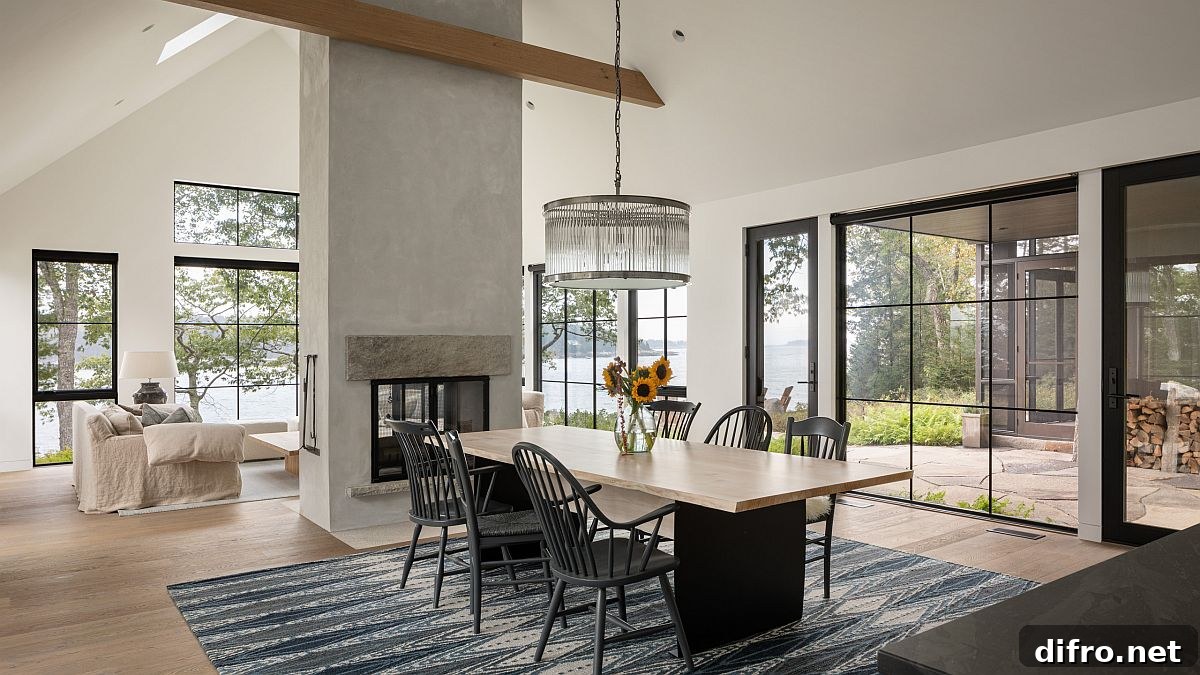 Beach-style dining room with double-sided fireplace