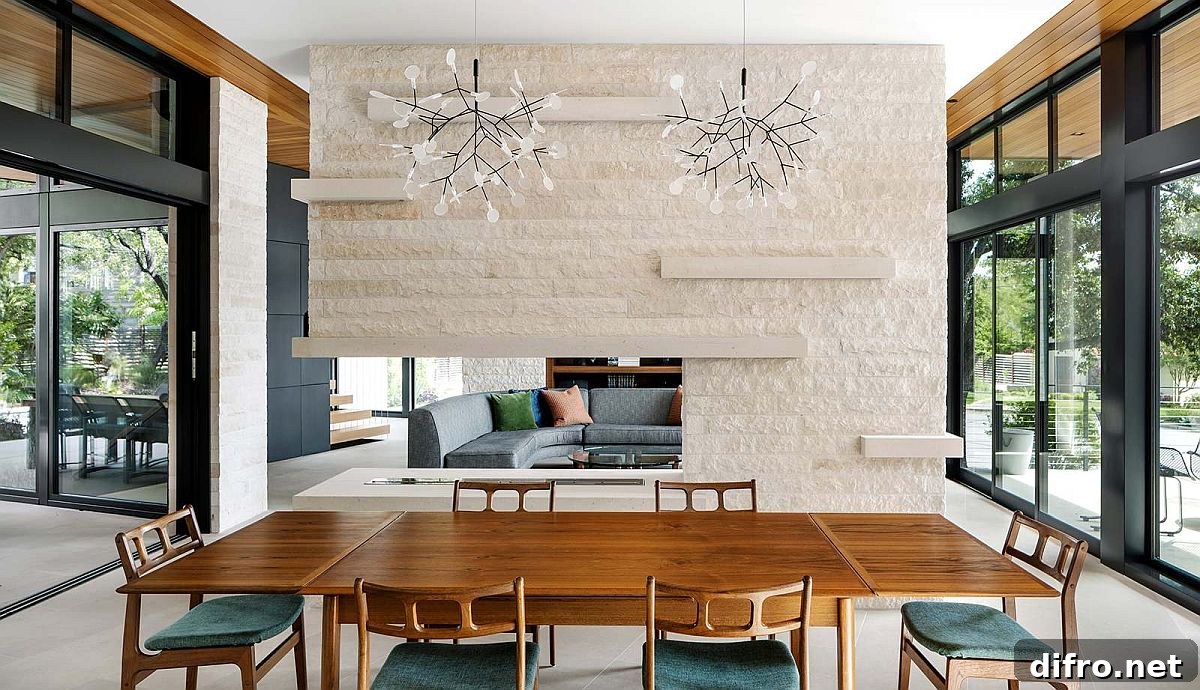 Stone two-sided fireplace shared by living and dining areas