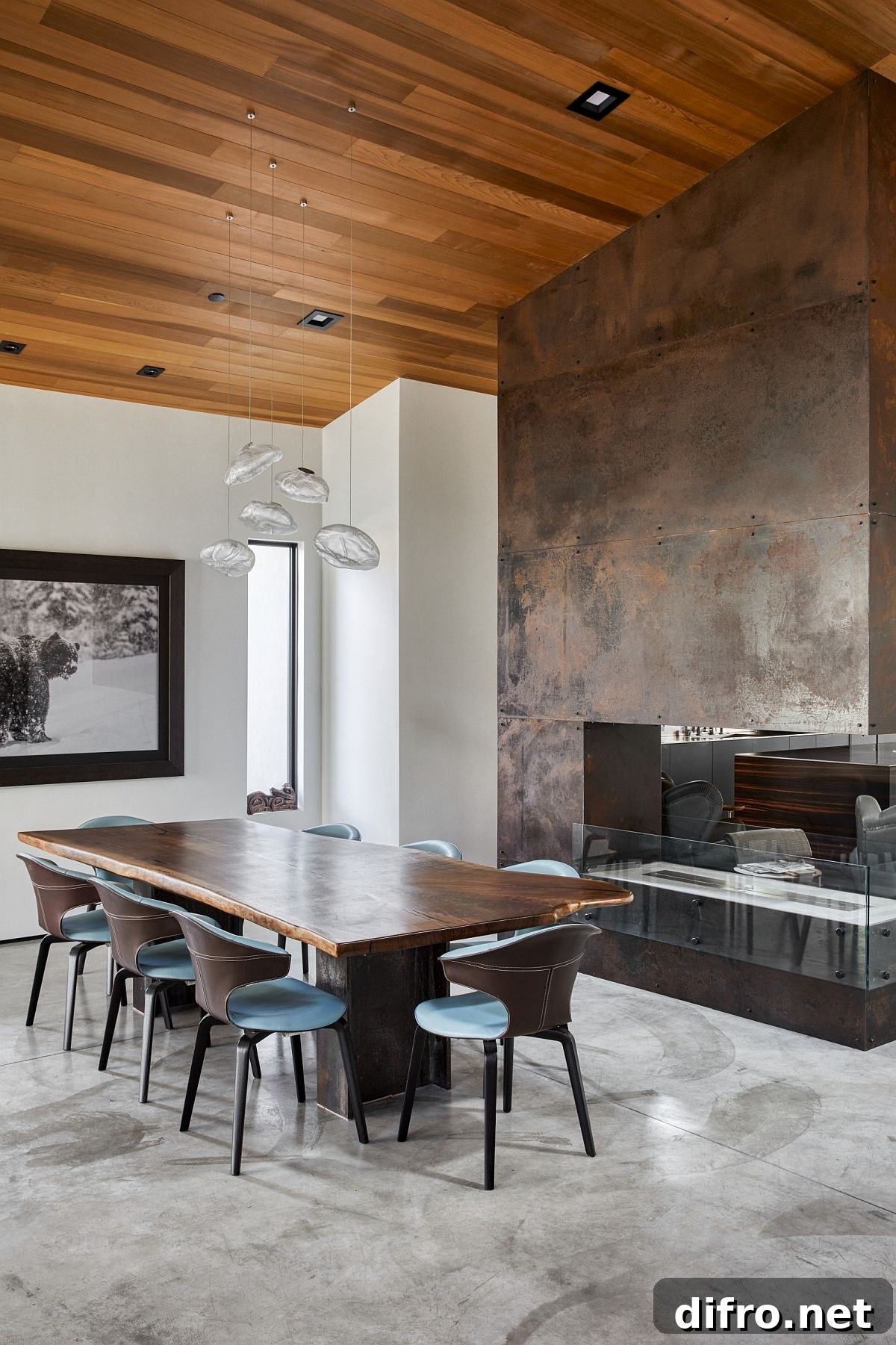 Dining room with double-sided fireplace and metallic wall