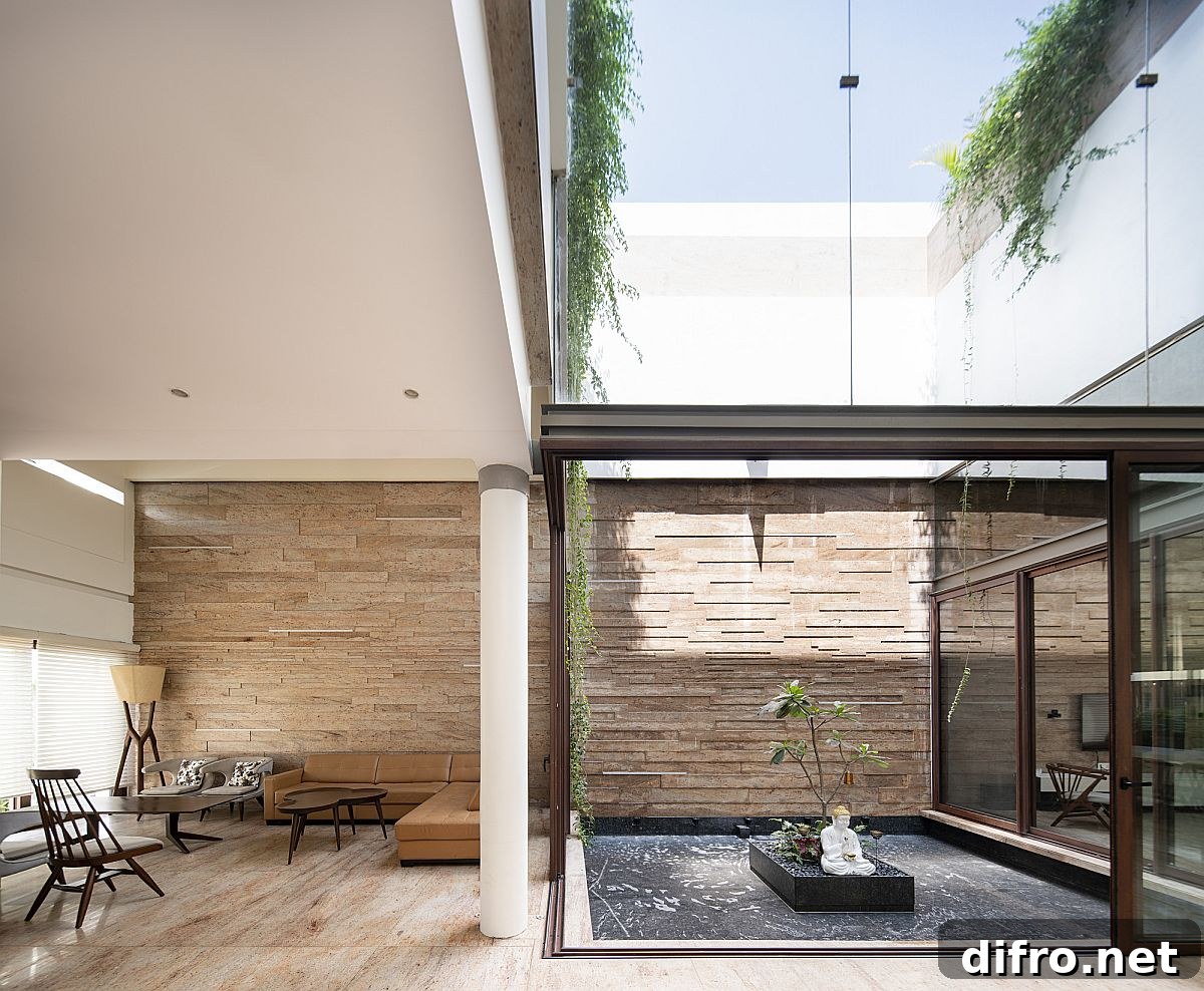 Interior view showing abundant greenery and light from the central courtyard