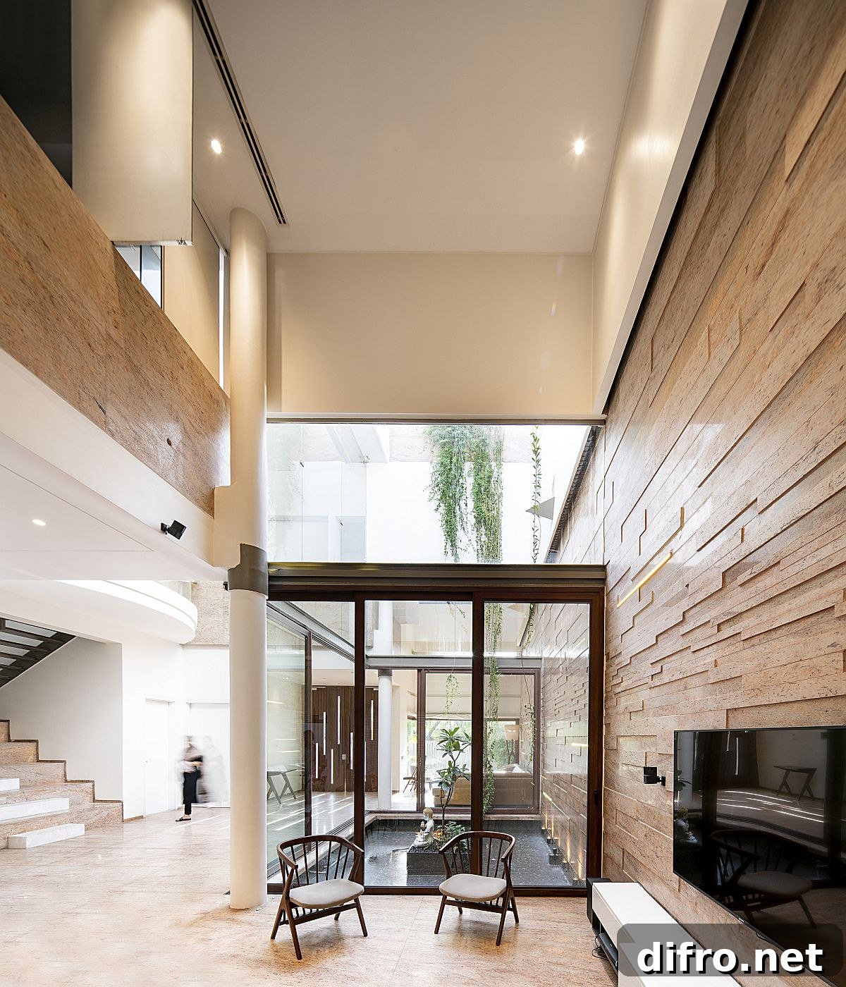 Ground floor living and dining areas with courtyard water feature