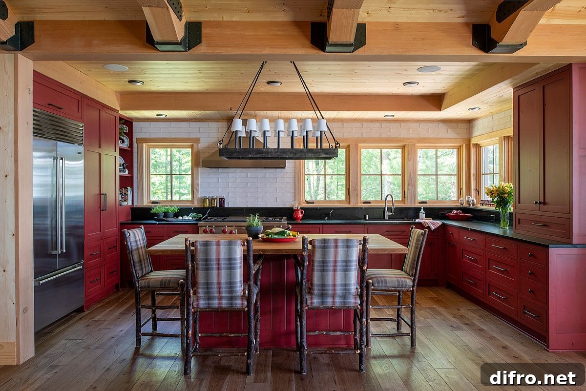 Red cabinets and patterned chairs around a kitchen island