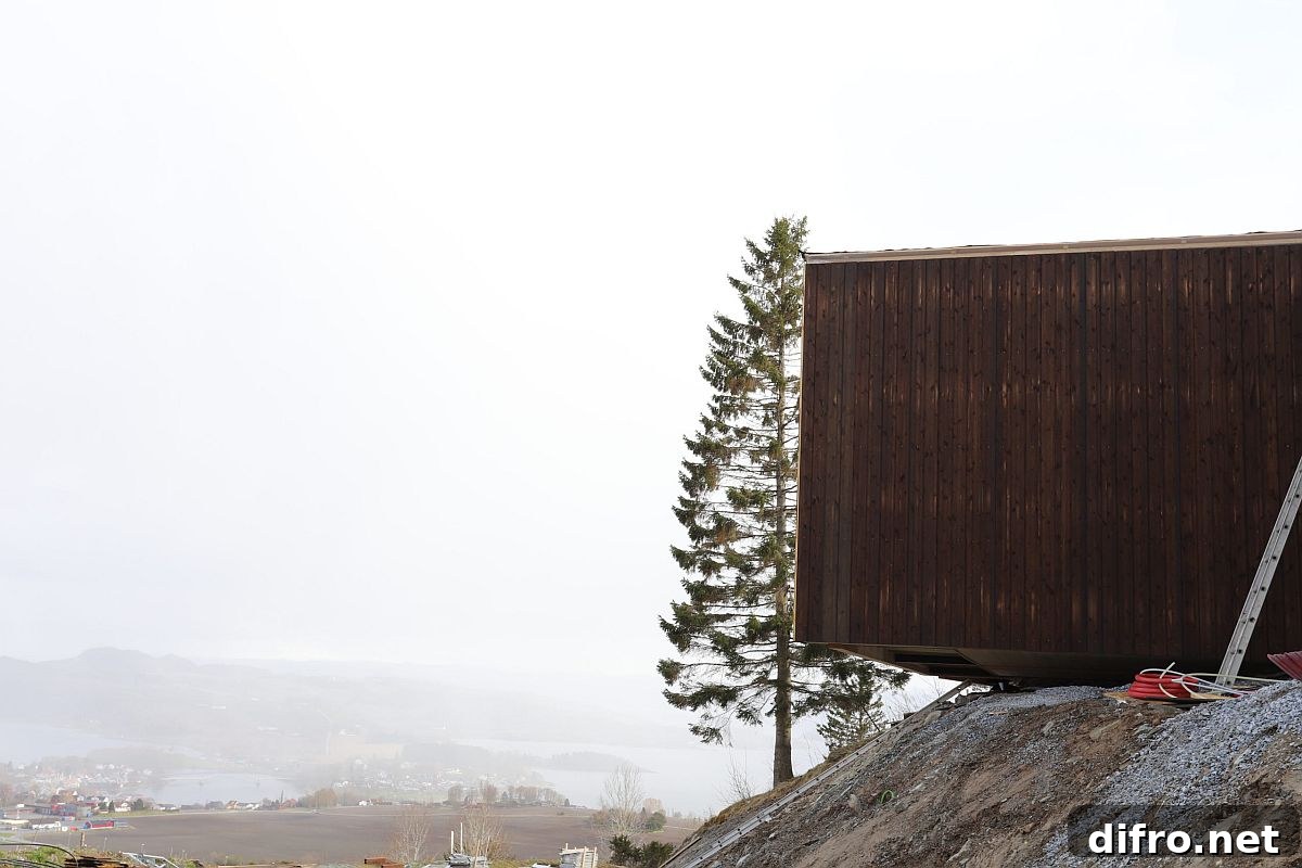 Cabin-style wooden units have been anchored to the ground even as the overlook distant landscape