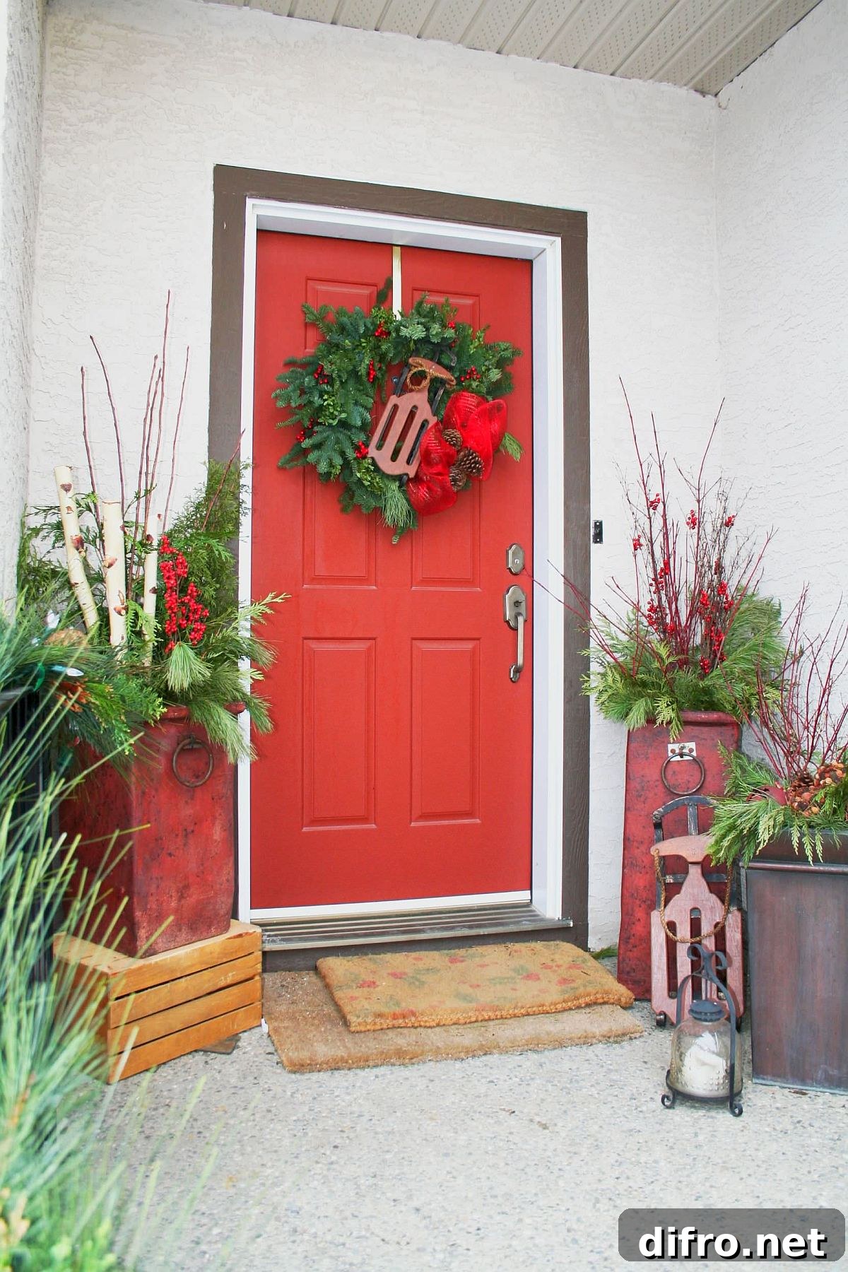 Potted plants with pops of red and wreath
