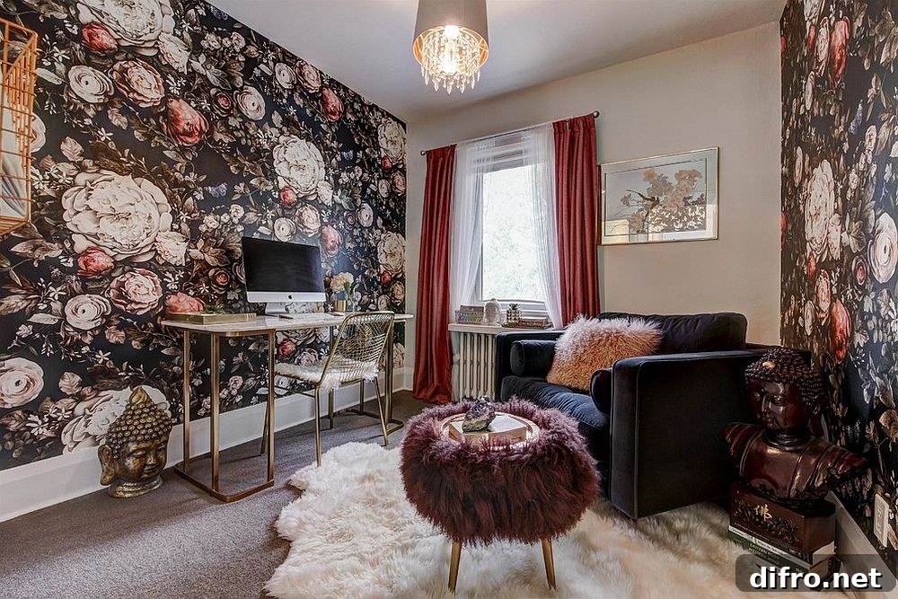 Eclectic home office with wallpaper and gold desk
