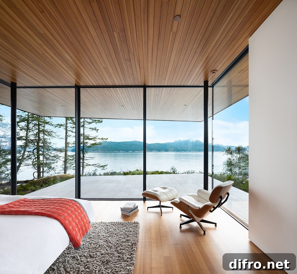 Bedroom with floor-to-ceiling glass and ocean views