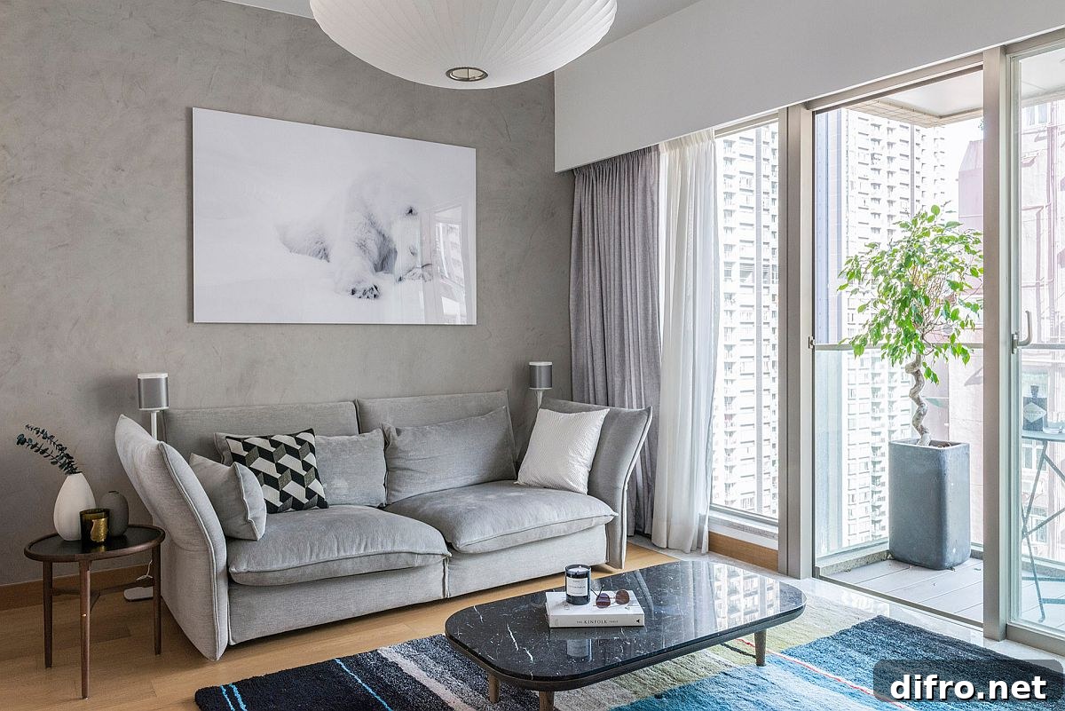 Contemporary living room with gray accents and an accent wall