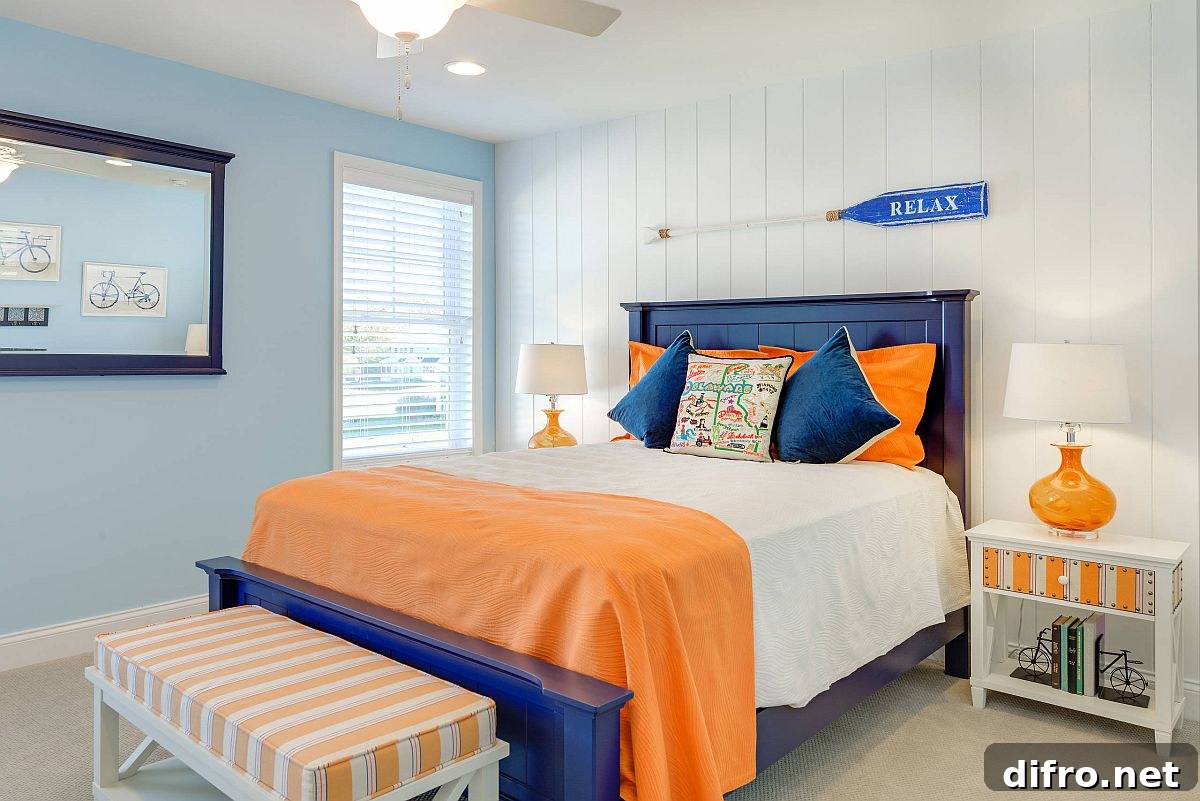 Neutral bedroom with blue and orange nautical accents