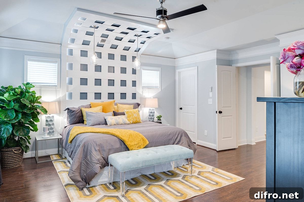 Bedding and rug add yellow and gray to a neutral bedroom