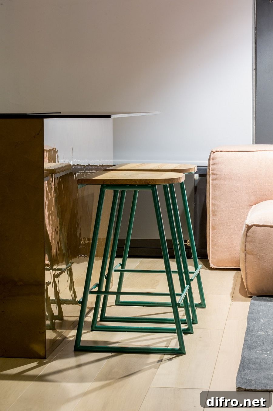 Lovely bar stools in wood with a sea green metallic base