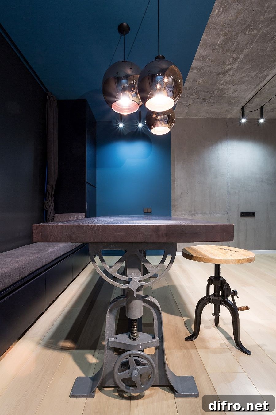 Old industrial machinery has been revamped to create the dining table base