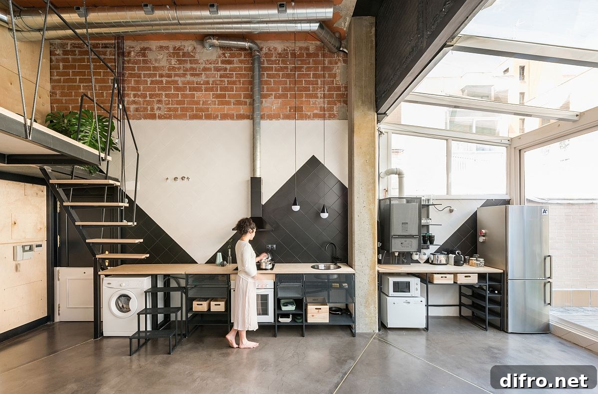 Glass walls and skylights bring natural light into the new living space and kitchen