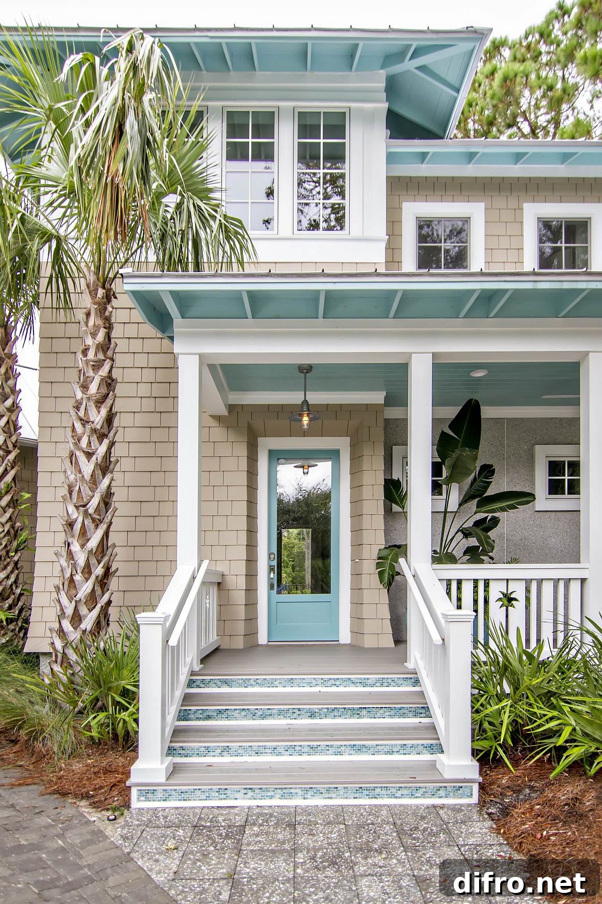White facade brightened by light turquoise accents for a beachy vibe