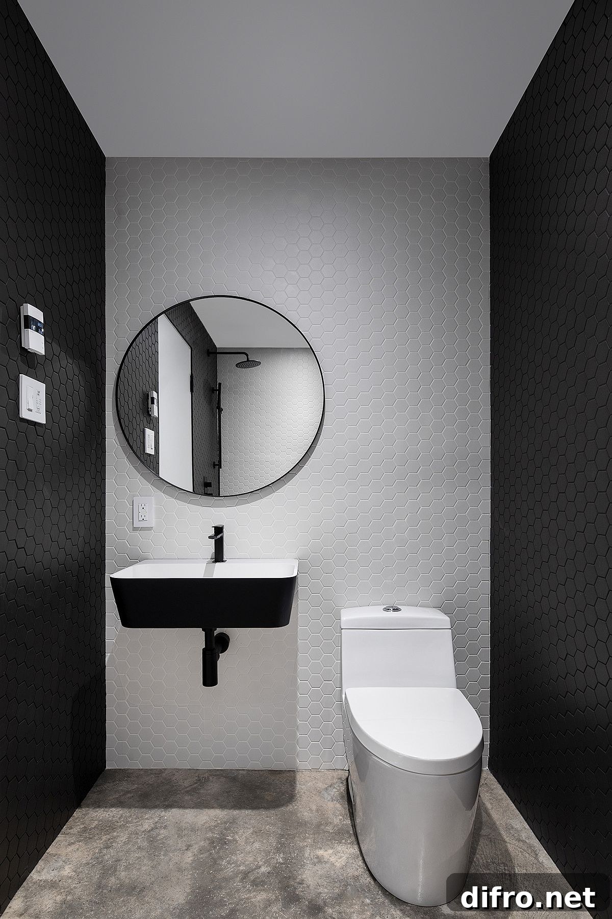 Hexagonal gray and white tiles in the contemporary powder room