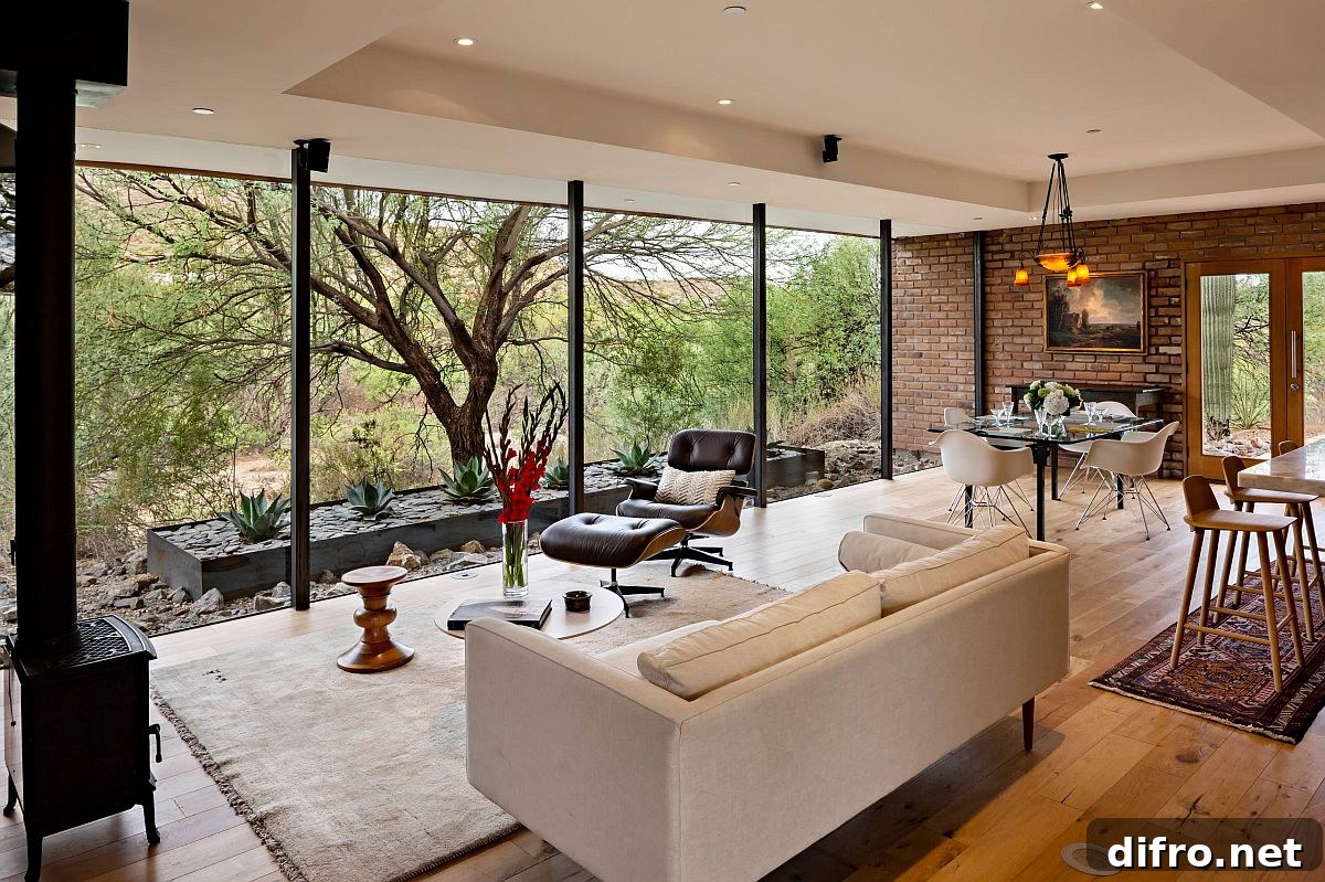 Floor-to-ceiling glass walls connecting interior and exterior