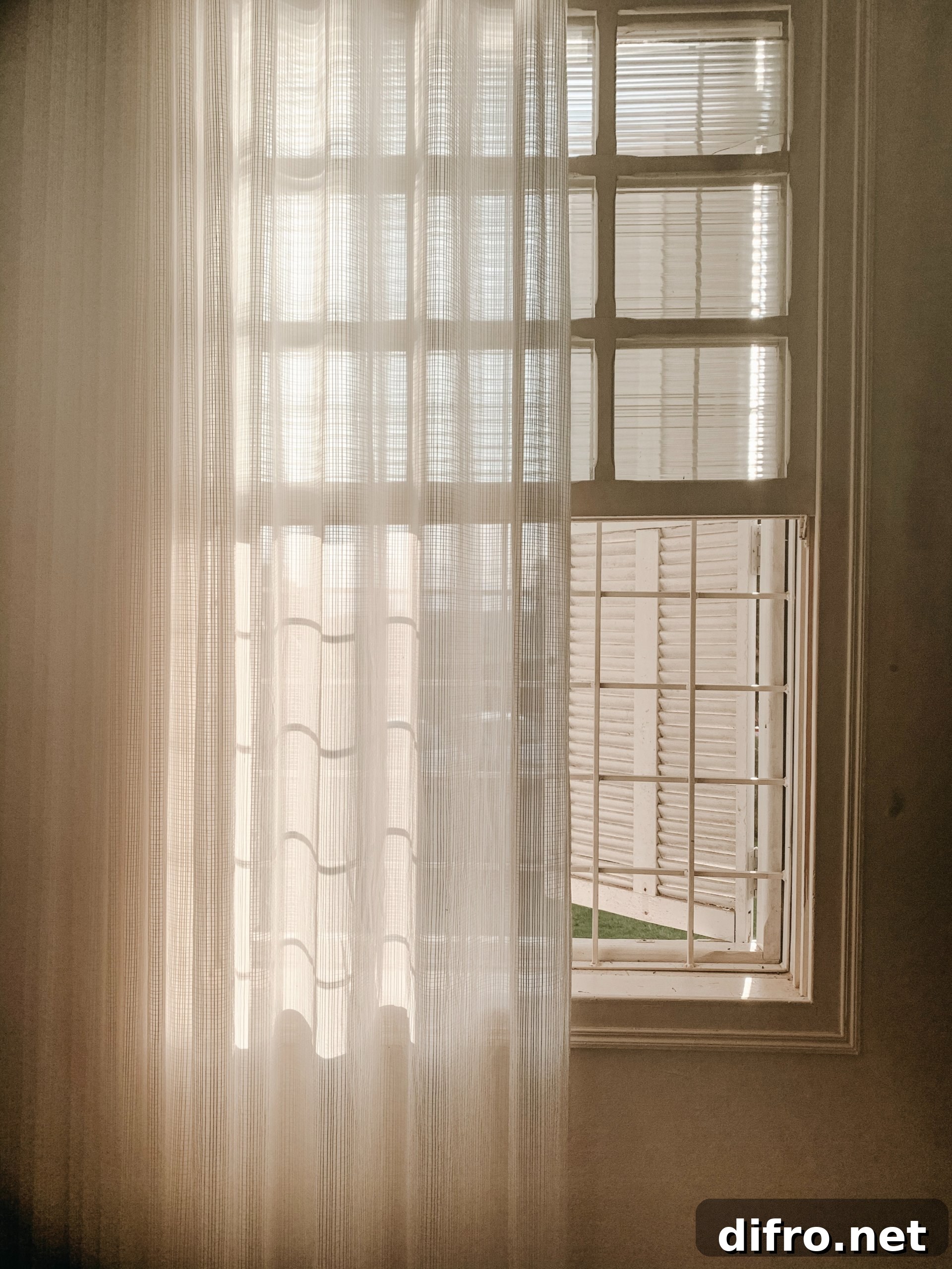 sheer curtain in front of french style window