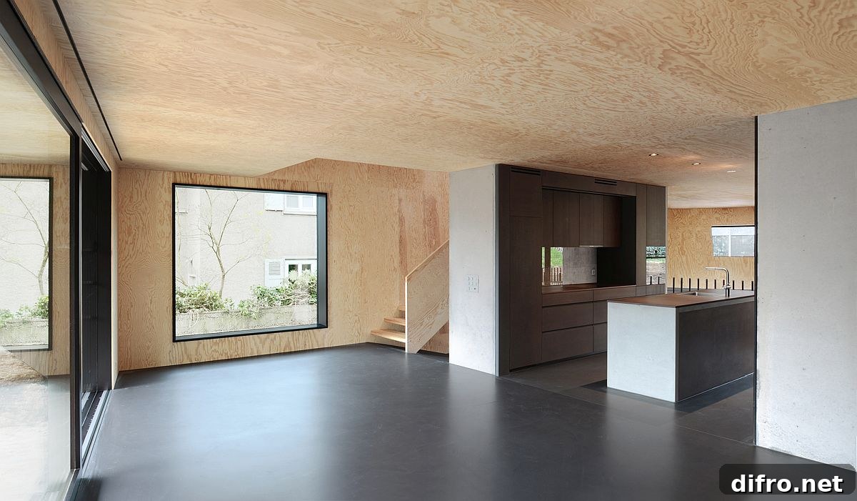 Lower level with wooden walls and concrete floor